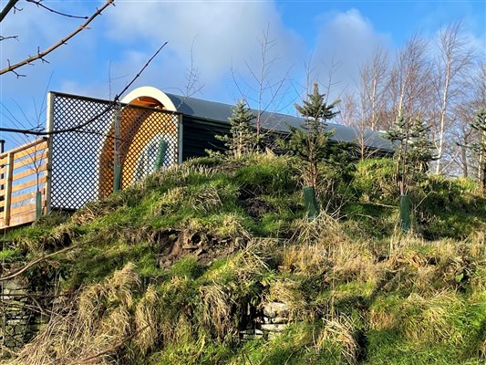 Cabins set high up on the farm overlooking the valley